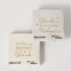 Boltze Servietten Glück – hochwertige Papierservietten mit gold geprägten Sprüchen und Herzen.