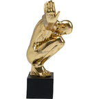 Goldene Dekofigur Athlet in Hocke auf schwarzem Sockel, glänzende Skulptur als edles Wohnaccessoire