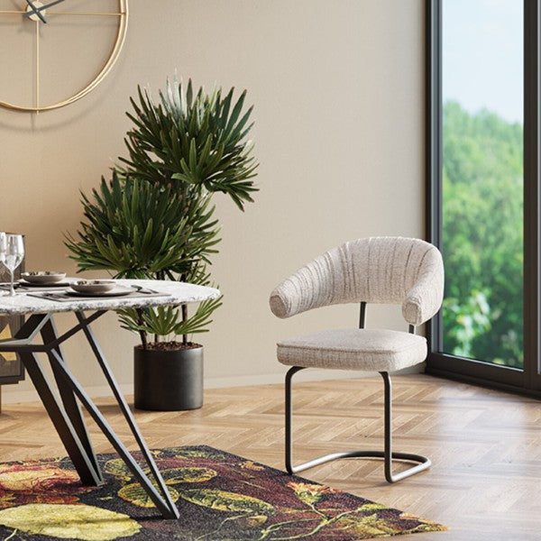 Fauteuil pivotant en tissu argenté de la marque Kare