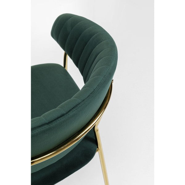 Fauteuil en velours vert de Kare