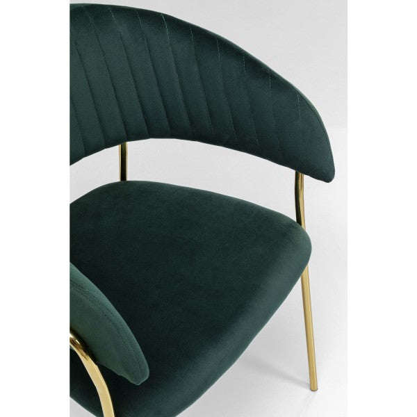 Fauteuil en velours vert de Kare