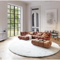 Candy Megasofa Cord Rusty im eleganten Wohnzimmer mit Naturholzboden und grossem Fenster