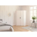 Rauch Allrounder Eckschrank Weiss im modernen Schlafzimmer mit Holzboden und heller Wandgestaltung