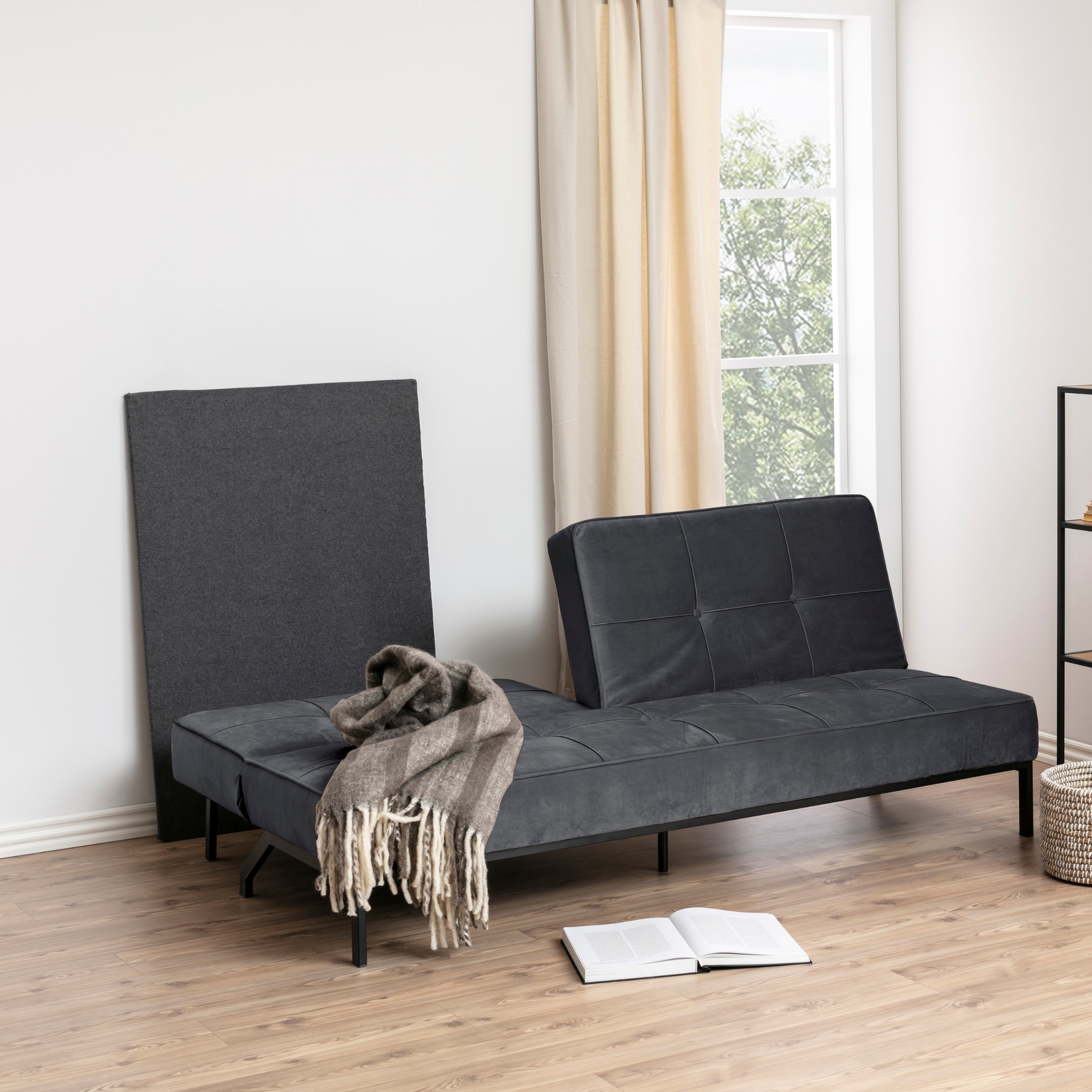 Canapé-lit gris avec dossier réglable