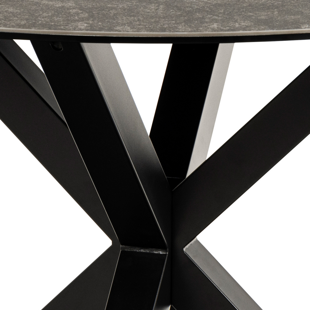 Table de salle à manger ronde aspect marbre noir avec un élégant cadre en métal