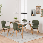 Actona Batilda Stuhl in Grün mit Holzbeinen um Glastisch in hellem Scandinavian Esszimmer