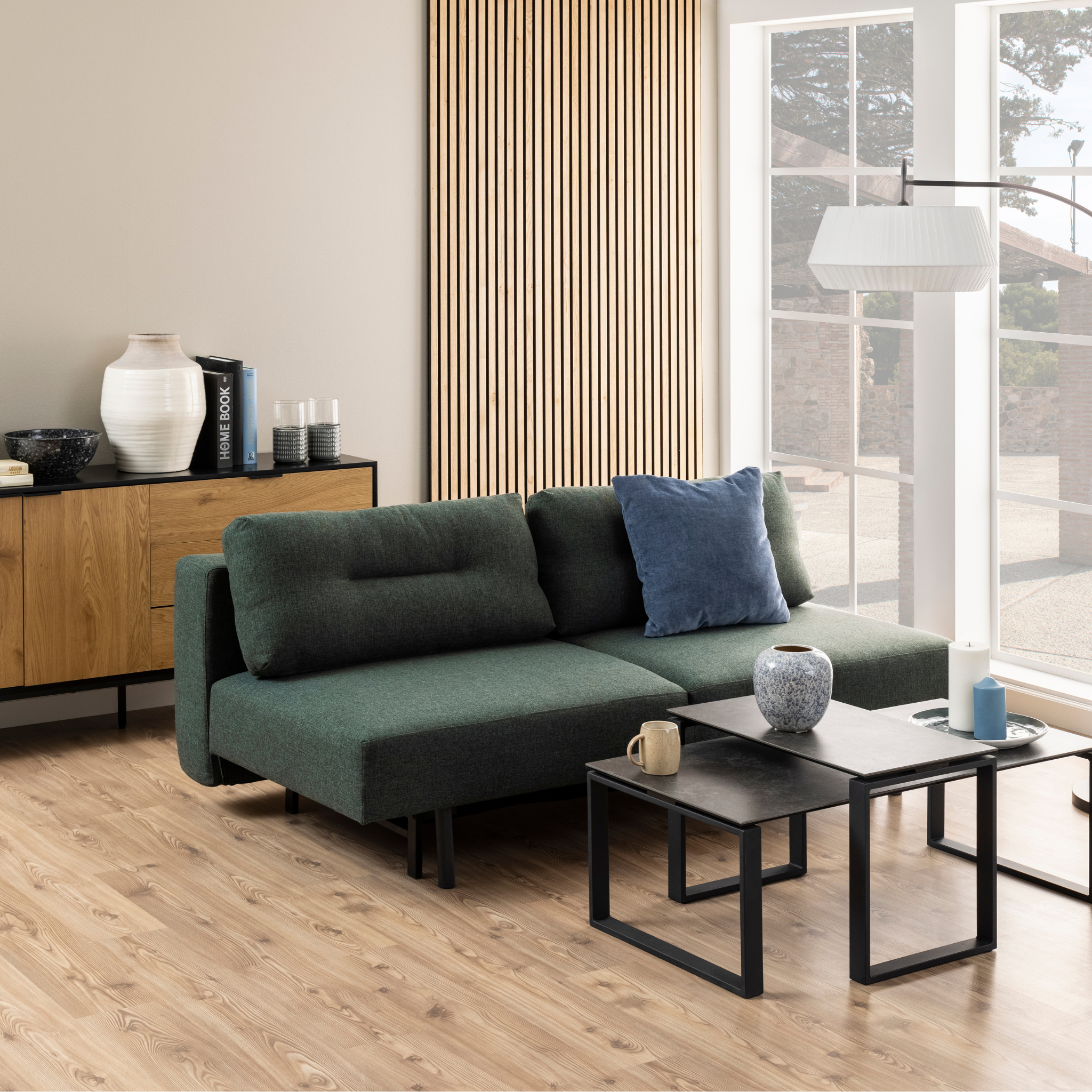 Canapé-lit vert avec dossier rabattable