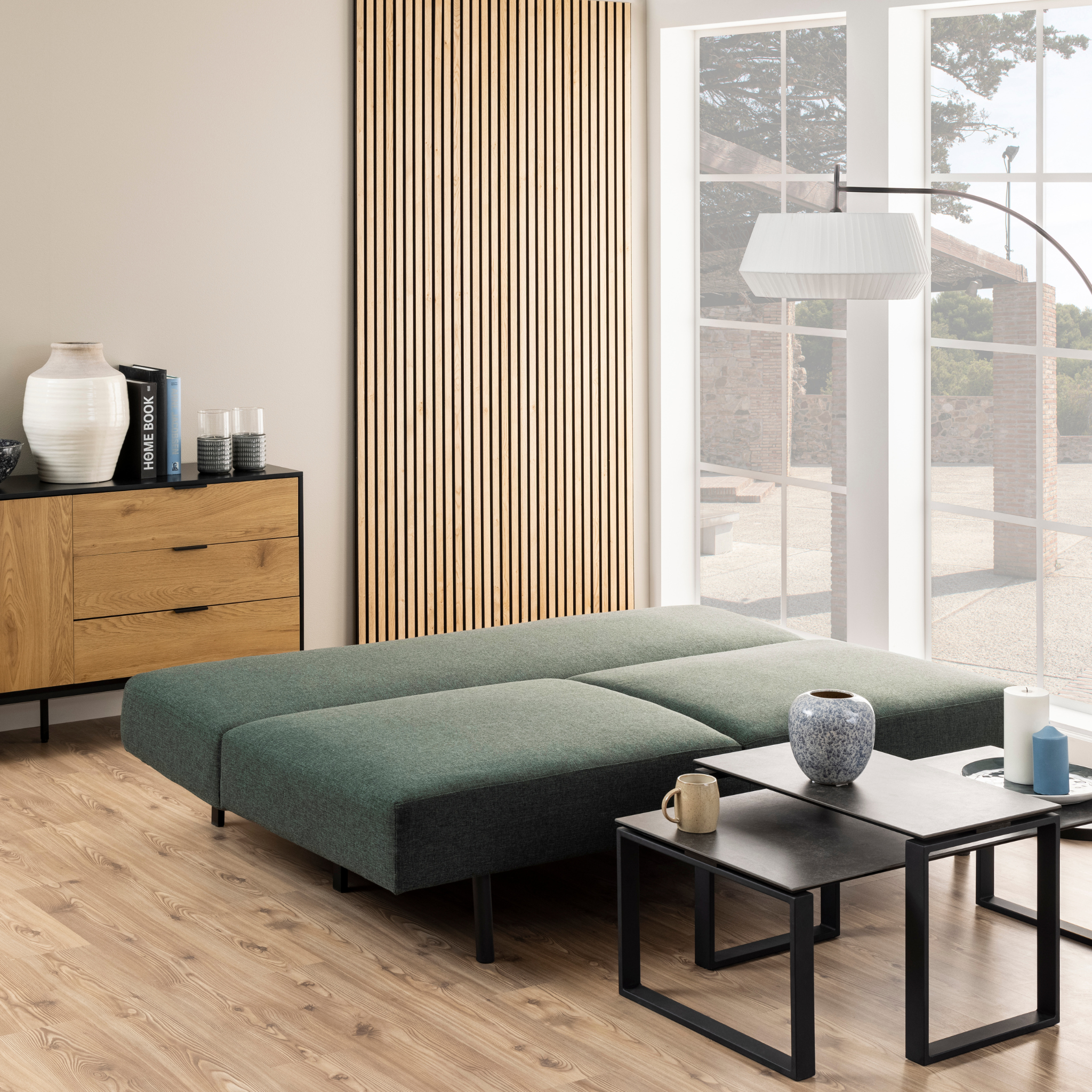 Canapé-lit vert avec dossier rabattable