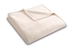 Biederlack Kuscheldecke Feel in Beige, gefaltet mit Rippenstruktur, weiche Fleecedecke für gemütliche Wohnmomente