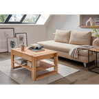 Couchtisch Pablo aus Eiche massiv mit Ablageboden im modernen Wohnzimmer mit Bouclésofa