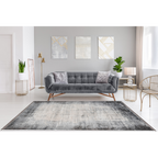 Lalee Elysee Teppich in Grau unter modernem Samtsofa in elegantem Wohnzimmer mit Gold-Akzenten