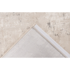 Rückseite Teppich Pierre Cardin Chalet beige silber – gefaltete Ecke zeigt Unterseite und Naht