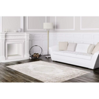 Lalee Paris Pierre Cardin Teppich Taupe 160x230cm im eleganten weissen Wohnzimmer mit Sofa und Kamin