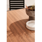 Gartentisch Hilija von Bizzotto mit Holzoptik, Topf und Schale auf Terrasse
