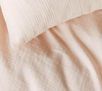 Musselin Bettwäsche Smooth in Hellorange - weiches Naturmaterial mit feiner Struktur, Detail Nahaufnahme