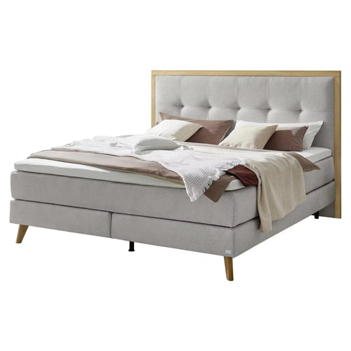Boxspringbett grau mit Holzrahmen, Polsterkopfteil und Metallbeinen – modernes Schlafzimmer